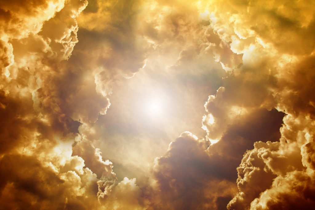 Sun coming through clouds